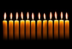 Twelve alight candles over the black background