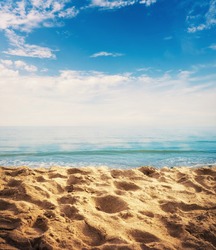 Beach background with sand, ocean and sky