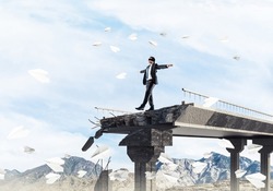 Businessman walking blindfolded among flying paper planes on concrete bridge with huge gap as symbol of hidden threats and risks. Skyscape and nature view on background. 3D rendering.
