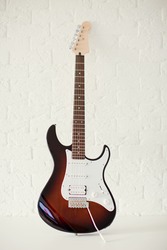 Dark colored stratocaster electric guitar