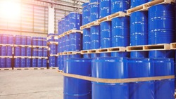 Blue barrel tank on the wood pallet in warehouse storage yard , Industrial and Warehouse business concept