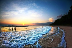 People Swimming in Ocean During Sunset in Costa Rica