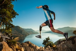 Disabled man with prosthetic leg, jumping in Patagonia.