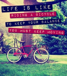 a quote: life is like riding a bike to keep your balance you must keep moving, over a bike photo toned with a retro vintage instagram filter app or action