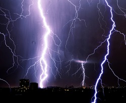 Lightning storm over city, thunderbolt