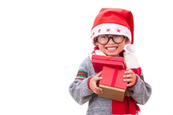 Happy boy in Santa red hat holding Christmas gift and wearing glasses. Christmas concept. 