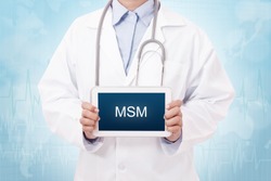 Doctor holding a tablet pc with MSM sign on the display