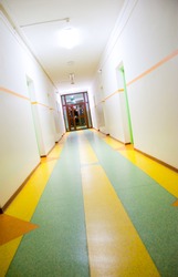 Diagonal view of the corridor with door at the end