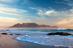 Table mountain in cape town south africa scenic view from bloubergstrand at sunset