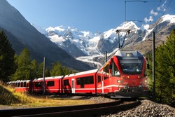 switzerland  train in front of glacier Morteratsch Bernina