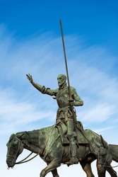 Closeup of the bronze statue of Don Quixote de la Mancha, part of the monument to Miguel de Cervantes, 1929, in Plaza de Espana, Madrid downtown, Spain, southern Europe. 
