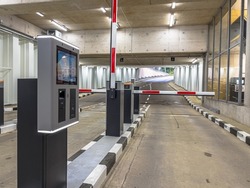 Barrier at Entrance and Exit of a car Parking garage. Fully automated barrier from car park. Underground parking, garage. Interior of parking