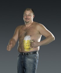 studio photography of a man with painted beer glass on his body in gradient back, signalling allright