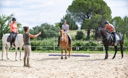  riding girl are training her horse in equestrian center