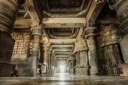Columns and empty corridor inside the 12th century stone temple Hoysaleswara, now Karnataka state of India.
