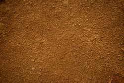 Red dirt (soil) background or texture. 