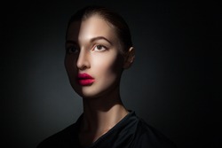 Attractive model with pink lips and shadow casting on face