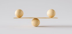 wooden scale balancing two big wodden balls. Concept of harmony and balance