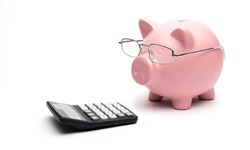 Piggy Bank with calculator on white background