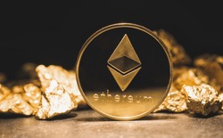 cryptocurrency Ethereum and a mound of gold nuggets - Business concept image