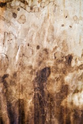 Grungy background of old stained paper with foxing and dirt