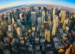 Fisheye aerial panoramic view over upper Manhattan, New York. Sunset of a clean, sunny day with exceptional visibility.