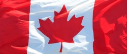 Canadian Flag waving in the wind background
