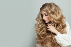 Nice woman with long healthy blonde hair on white banner background