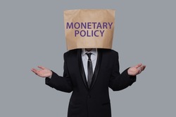 Monetary policy concept. Businessman think about monetary policy