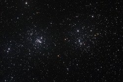 Starfield with The Double Cluster (Cadwell 14) in the constellation of Perseus formed by two open clusters NGC 884 and NGC 869.