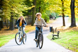 Urban biking - teens and bikes in city park