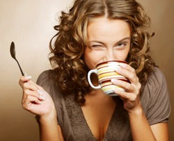 young pretty woman drinking coffee