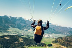 Paraglider is on the paraplane strops - soaring flight moment