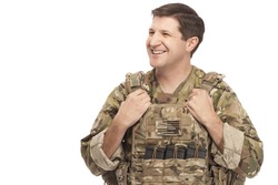 Smiling army soldier looking away