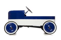 Vintage pedal car toy isolated on white background