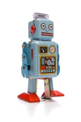 Old cheap toy robot isolated on white background