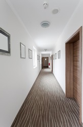 hotel hallway with many doors
