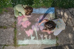 Kids Drawing with Chalk on Sidewalk