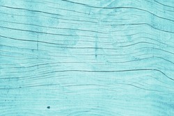 Painted plain blue and rustic wood board background. Tinted photo.