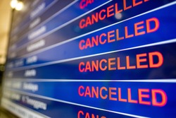 Airport screen indicating cancelled flights due to the Coronavirus pandemic 