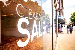 Empty shop window with Clearance Sale text