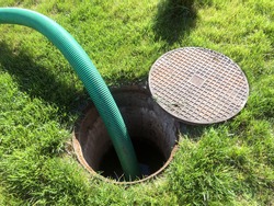 Clogged septic tank. Emptying the septic tank