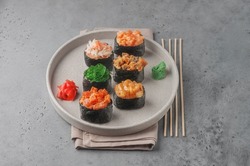 set of gunkan sushi on gray background