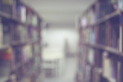Blurred books on the shelf in public library. Blurred effect. Background for your pictures