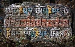 The stone along trek on which  ancient buddhist texts - Everest region, Nepal