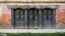 Carved wooden doors at the 9 th century building - Bhaktapur, Nepal 
