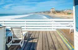 Beach chair on a wooden boardwalk in Pacific Beach, San Diego. California, USA