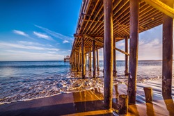 wooden poles in Malibu pier, California
