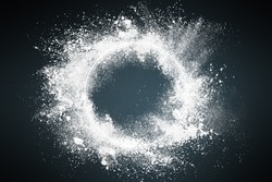 Abstract design of dust explosion frame background. Powder particles sprayed over dark backdrop
