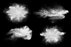 Set of dust powder splash clouds isolated on black. Flour particles exploding over dark background